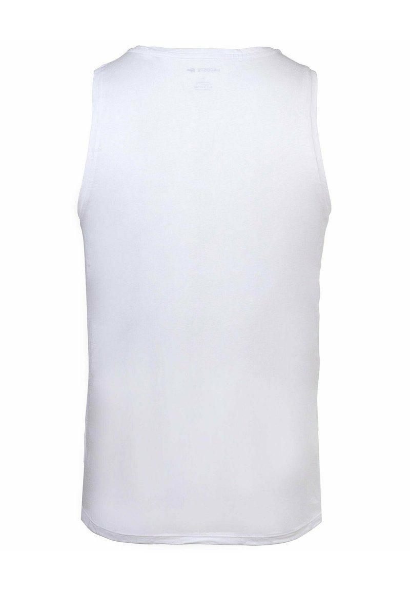 Top bianco senza maniche realizzato in tessuto liscio, con collo tondo e senza motivi visibili o accessori. Design semplice e minimalista.