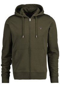 Felpa con cappuccio verde oliva, con zip completa, polsini a costine, tasche frontali e logo sul petto. Tessuto in morbida miscela di cotone.