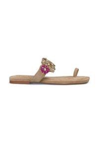 Beige suede flat sandals with a decorative gold and pink gem accent on the upper strap. Features a minimalist design and open toe.
