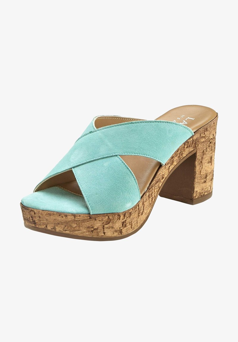 Aqua suede high-heeled sandal with crossed straps and cork platform. The heel is block-shaped, offering stability and support.