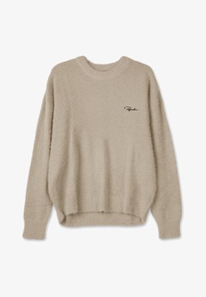 Beige pūkains džemperis ar apaļu kakla izgriezumu, garām piedurknēm un nedaudz īsu apakšmalu. Uz kreisā krūšu laukuma ir izšūta logo.