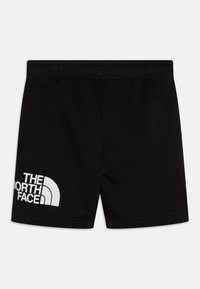 Juodos medvilninės šortai su elastinga juosmens juosta ir balta "THE NORTH FACE" logotipo atspaudą ant kairės kojos apačios.