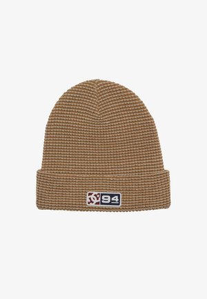 Brown knit beanie with a textured pattern, featuring a folded cuff and a colorful logo patch on the side.