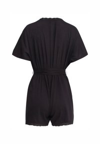 Black short romper with short sleeves, elastic waist, and scalloped hem details. Made from lightweight fabric for comfort and ease of wear.