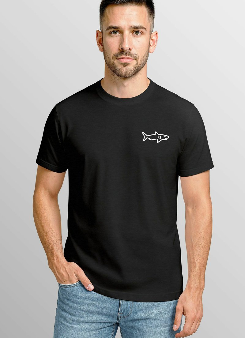 Black t-shirt with a round neckline and short sleeves, featuring a white shark graphic on the left chest. Smooth fabric texture.