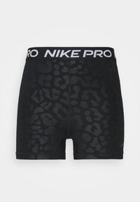 Shorts de compression Nike Pro noirs avec un léger imprimé léopard sombre et un logo blanc sur la ceinture élastique.