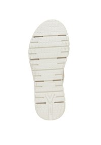 White rubber shoe sole with textured grip pattern, featuring grooves and a central V-shaped design for enhanced traction.