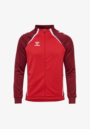 Giacca da corsa rossa con colletto alto, zipper completa e maniche rosso scuro a contrasto. Presenta dettagli bianchi e il logo hummel sul petto.