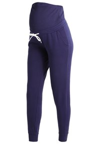 Námořnické těhotenské joggery s vroubkovaným pasem, stahovací šňůrkou, bočními kapsami a zúženými nohavicemi, vyrobené z měkkého a elastického materiálu.