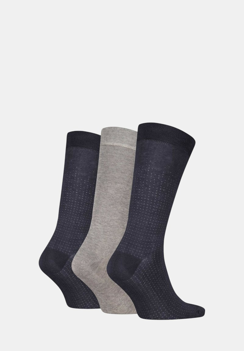 Tre paia di calzini: due blu marino con un motivo a pois, uno grigio chiaro. Tutti hanno un risvolto a coste e una texture liscia.