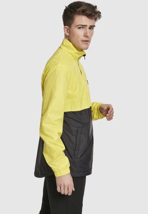 Urban Classics STAND UP COLLAR PULL OVER JACKET - Välikausitakki - brightyellow/blk