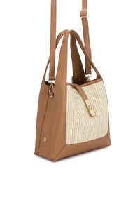 Tan leather and woven fabric tote bag with double handles, adjustable shoulder strap, and gold-tone clasp on a white background.
