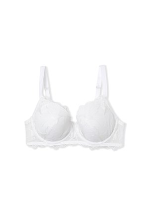 Soutien-gorge en dentelle blanche avec des motifs floraux brodés, coques semi-rembourrées, bretelles ajustables et bords ondulés pour plus de détails.