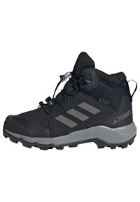 Black hiking boot with textured upper material, grey accents, and three gray stripes. Features a quick-lacing system and rugged outsole.