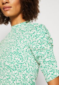 Lindex LORELAI - Μπλουζάκι με στάμπα - light beige