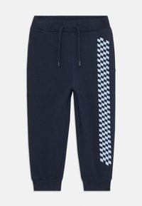 Pantalones de chándal azul marino de tejido suave con una cinturilla elástica, que presentan un patrón a cuadros en azul claro a lo largo del lado exterior.