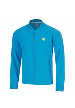 Blaue Jacke mit Reißverschluss, langen Ärmeln, geripptem Kragen und Bündchen, kleinem gelben rundem Logo auf der Brust und Reißverschlusstaschen an den Seiten.