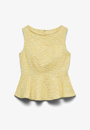 Dzeltens bezroku top ar pepluma siluetu, teksturētu ziedu izšuvumu un apaļu kakla izgriezumu, nolikts uz balta fona.