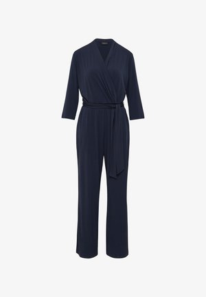 Granatowy kombinezon z zapinanym przodem, długimi rękawami i paskiem w talii. Wykonany z gładkiego, lekkiego materiału, z szerokimi nogawkami.