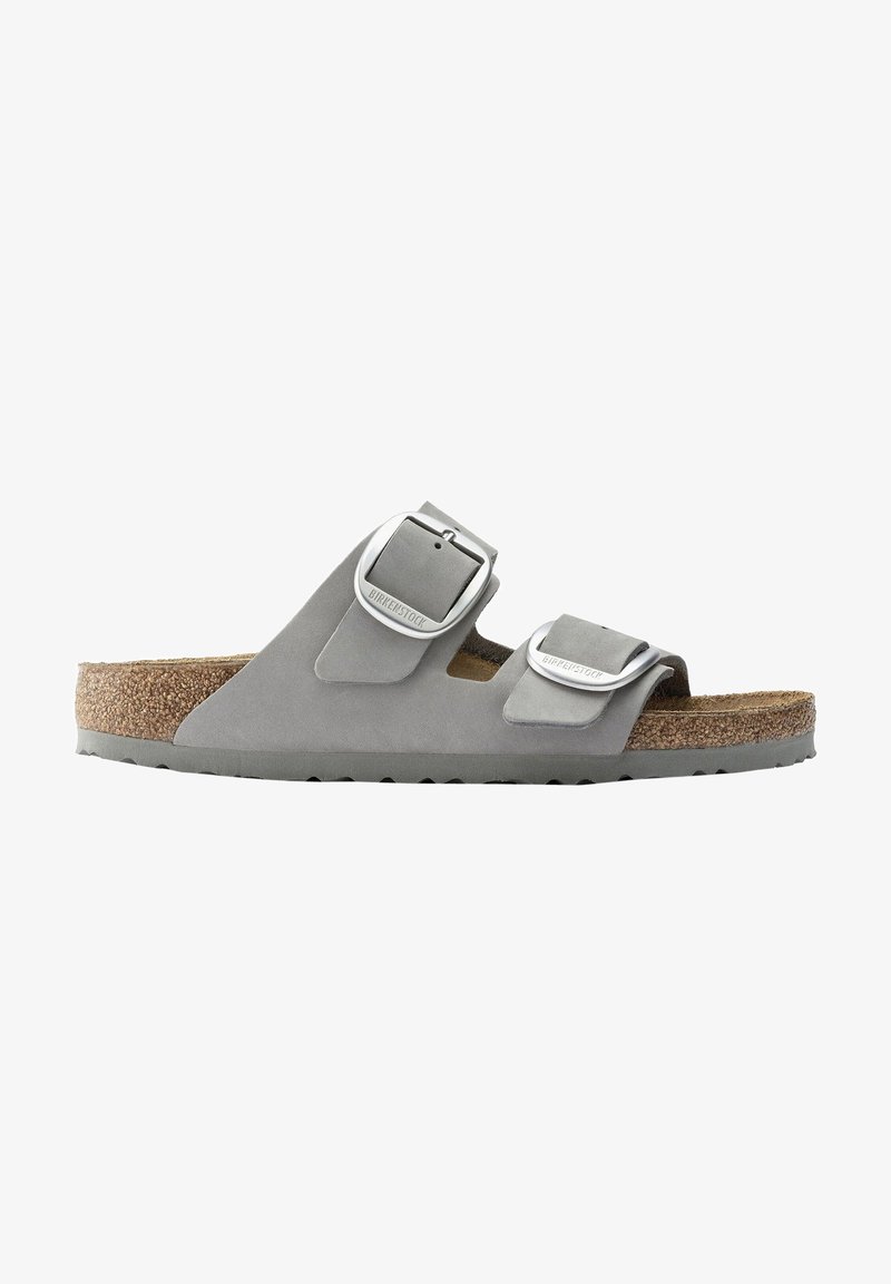 Gray two-strap sandal with adjustable silver-tone metal buckles, soft suede upper, and a cork footbed, featuring a textured rubber sole.