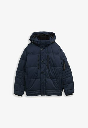 Giacca imbottita blu navy con cappuccio, dotata di tasche con zip, bottoni a scatto e polsini a coste. Texture liscia con pannelli trapuntati.