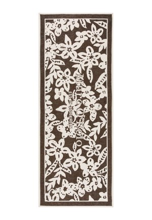 Brązowy prostokątny szalik z białym kwiatowym wzorem i tekstem „Marc O'Polo Est. w Sztokholmie” wyśrodkowanym pionowo.