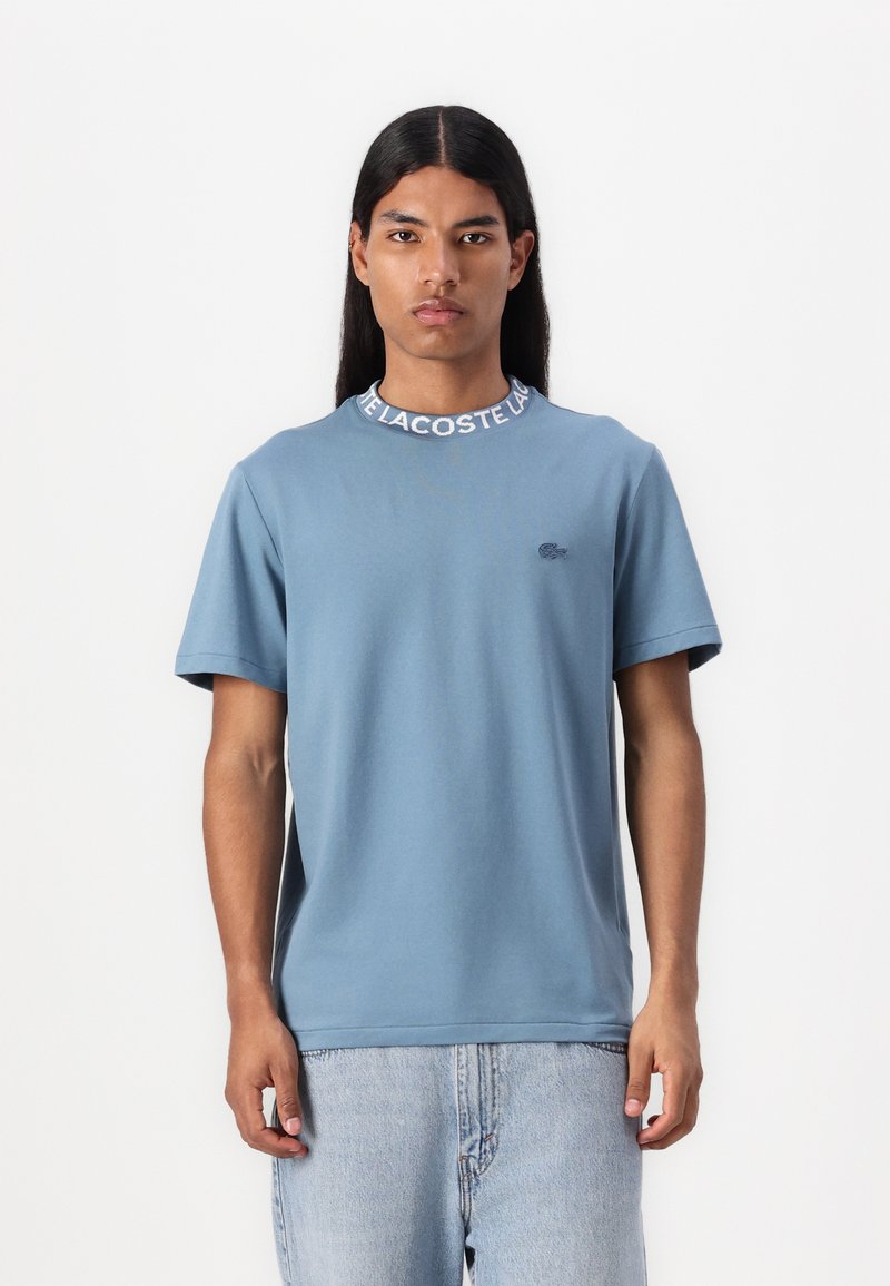 Lacoste - UNISEX - Tricou cu imprimeu - limestone, Extindeți