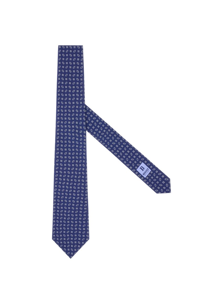 Corbata azul marino con un diseño estampado de formas geométricas blancas. Hecha de tela, presenta un extremo en punta y una etiqueta en el lado estrecho.
