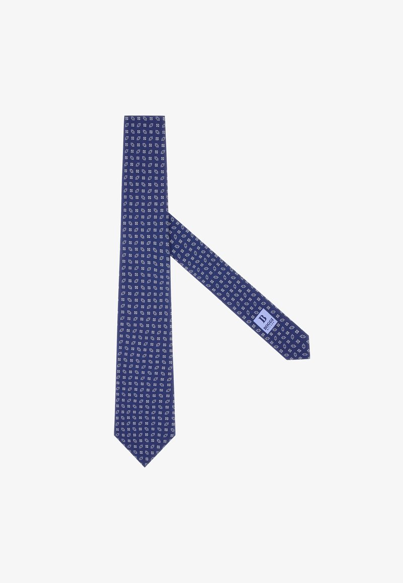Corbata azul marino con un diseño estampado de formas geométricas blancas. Hecha de tela, presenta un extremo en punta y una etiqueta en el lado estrecho.