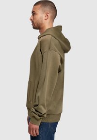 Merchcode NITM CRATE  ULTRA HEAVY - Kapucni - olive