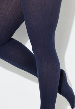 Marineblauwe panty's met een patroon en een getextureerd ontwerp, met verhoogde geometrische patronen en een gladde afwerking. Het materiaal lijkt rekbaar en ondoorzichtig te zijn.