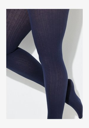 Marineblauwe panty's met een patroon en een getextureerd ontwerp, met verhoogde geometrische patronen en een gladde afwerking. Het materiaal lijkt rekbaar en ondoorzichtig te zijn.