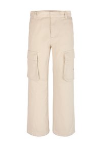 Pantalons cargo beiges avec une coupe ample, fabriqués dans un tissu résistant, dotés de deux grandes poches latérales et d'une taille cousue.