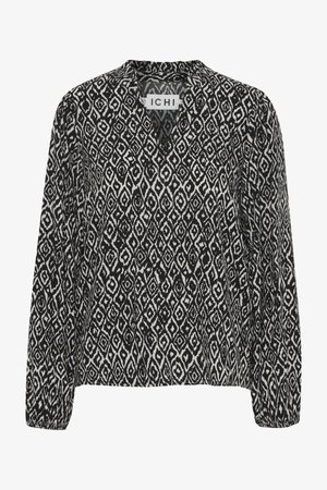 Schwarz-weiße Bluse mit geometischem Diamantmuster, langen Ärmeln und V-Ausschnitt. Hergestellt aus leichtem Stoff.