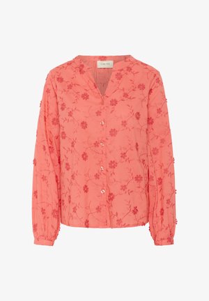 Korale srajca z dolgimi rokavi, V-izrezom in gumbnim zapenjanjem. Opremljena z rožnatim vezenjem in teksturirano tkanino z majhnimi izbočenimi detajli.