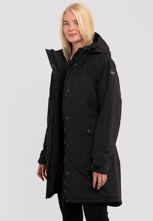 Schwarze Parkajacke mit Kapuze, ausgestattet mit Druckknöpfen und Reißverschluss, zwei Fronttaschen und einem weich texturierten Material.
