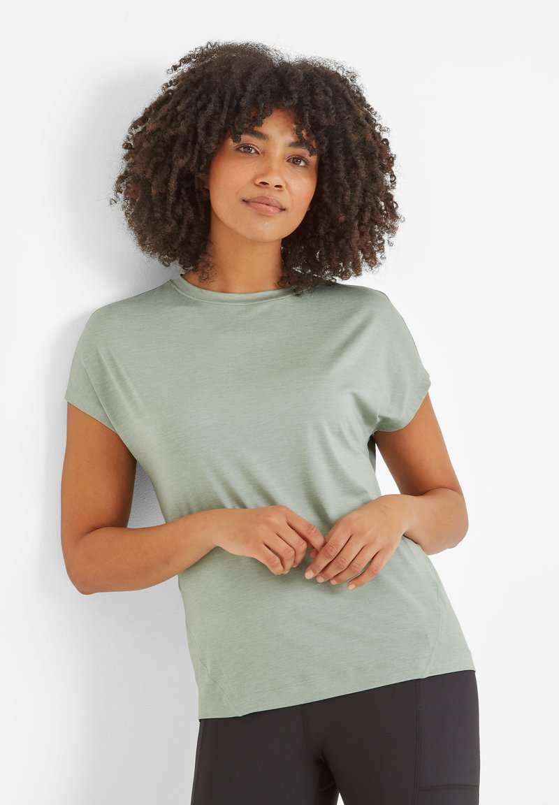 Light green short-sleeve top with a round neckline and a relaxed fit, made of soft fabric, paired with black leggings.