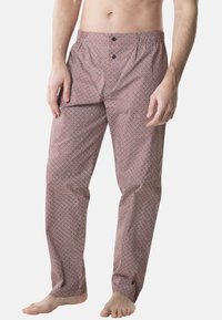 Pantalons de détente pour hommes en tissu à motifs, présentant un imprimé géométrique rouge et blanc, avec deux boutons à l'avant et une coupe décontractée.