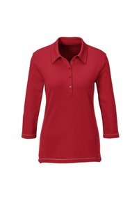 Rode polo shirt met driekwart mouwen, kraag en knopensluiting. Kenmerkt zich door contrasterende stiksels aan de zoom en mouwmanchetten.