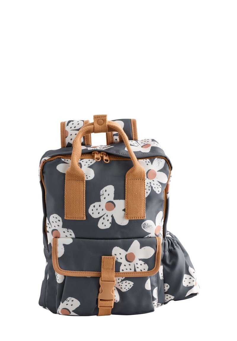 Gray fabric backpack with white flower patterns, peach dots, and brown straps. Features a front pocket and elastic side holder.