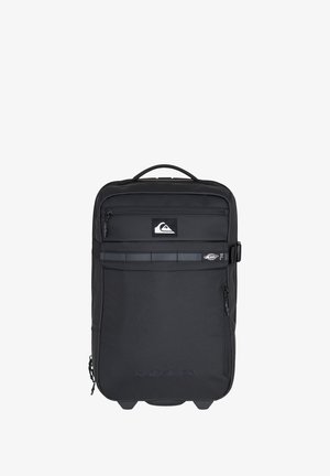 Black backpack made of durable fabric, featuring a front zip pocket, a logo, and a top handle. Smooth texture with a rectangular shape.