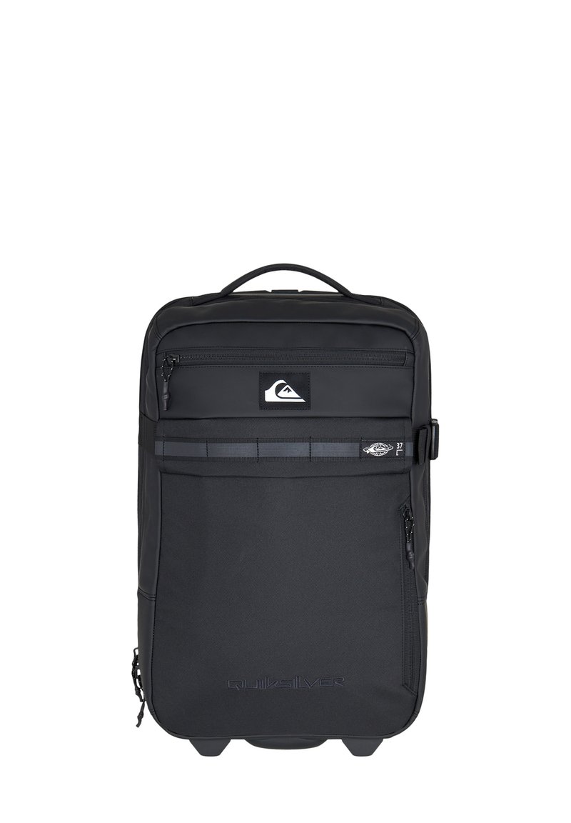 Black backpack made of durable fabric, featuring a front zip pocket, a logo, and a top handle. Smooth texture with a rectangular shape.