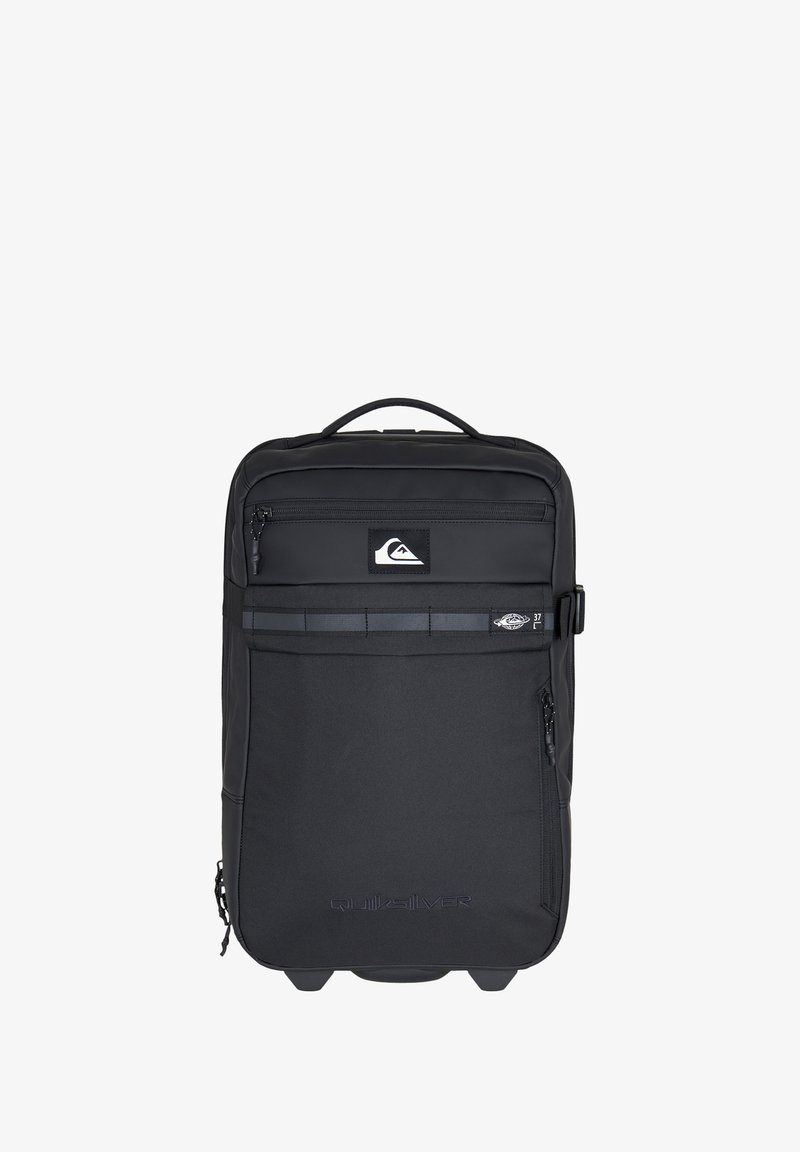 Black backpack made of durable fabric, featuring a front zip pocket, a logo, and a top handle. Smooth texture with a rectangular shape.