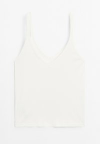 Bílá v-neck tílko s tenkými ramínky, vyrobené z žebrované tkaniny. Má přiléhavý střih a rovný lem, ideální pro vrstvení.