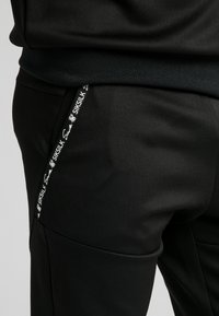 SIKSILK Teplákové kalhoty - black