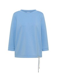Chemise bleu clair à manches longues avec col rond et cordon de serrage ajustable à l'ourlet sur fond blanc uni.