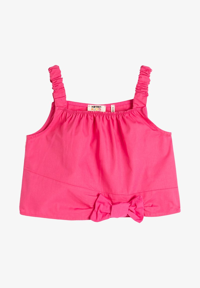 Haut sans manches rose vif pour fille avec des bretelles froncées et un nœud en tissu au centre en bas. L'étiquette indique "Koton Kids."