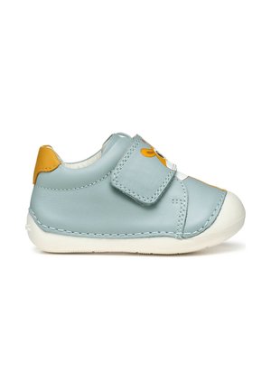 Light blue leather shoe with white rubber sole, stitched detailing, and yellow accent on the heel. Features a velcro strap closure.