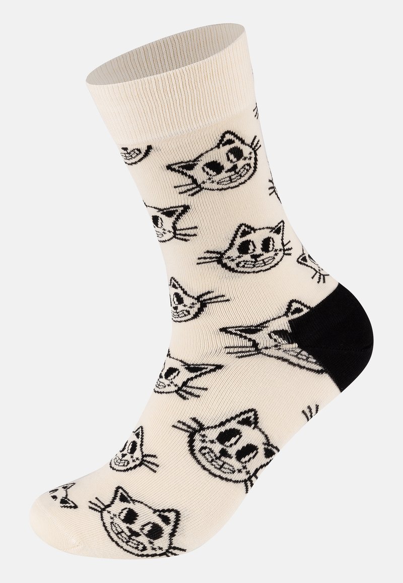 Kniehohe Socken aus einem cremefarbenen Stoff, der mit einem Muster von Katzenkopf in Schwarz versehen ist, mit einem schwarzen Akzent an der Ferse.