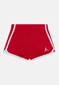 Pantaloni sportivi rossi con dettagli e rifiniture bianche, dotati di una cintura elastica e di un piccolo logo Jordan bianco sul lato sinistro.